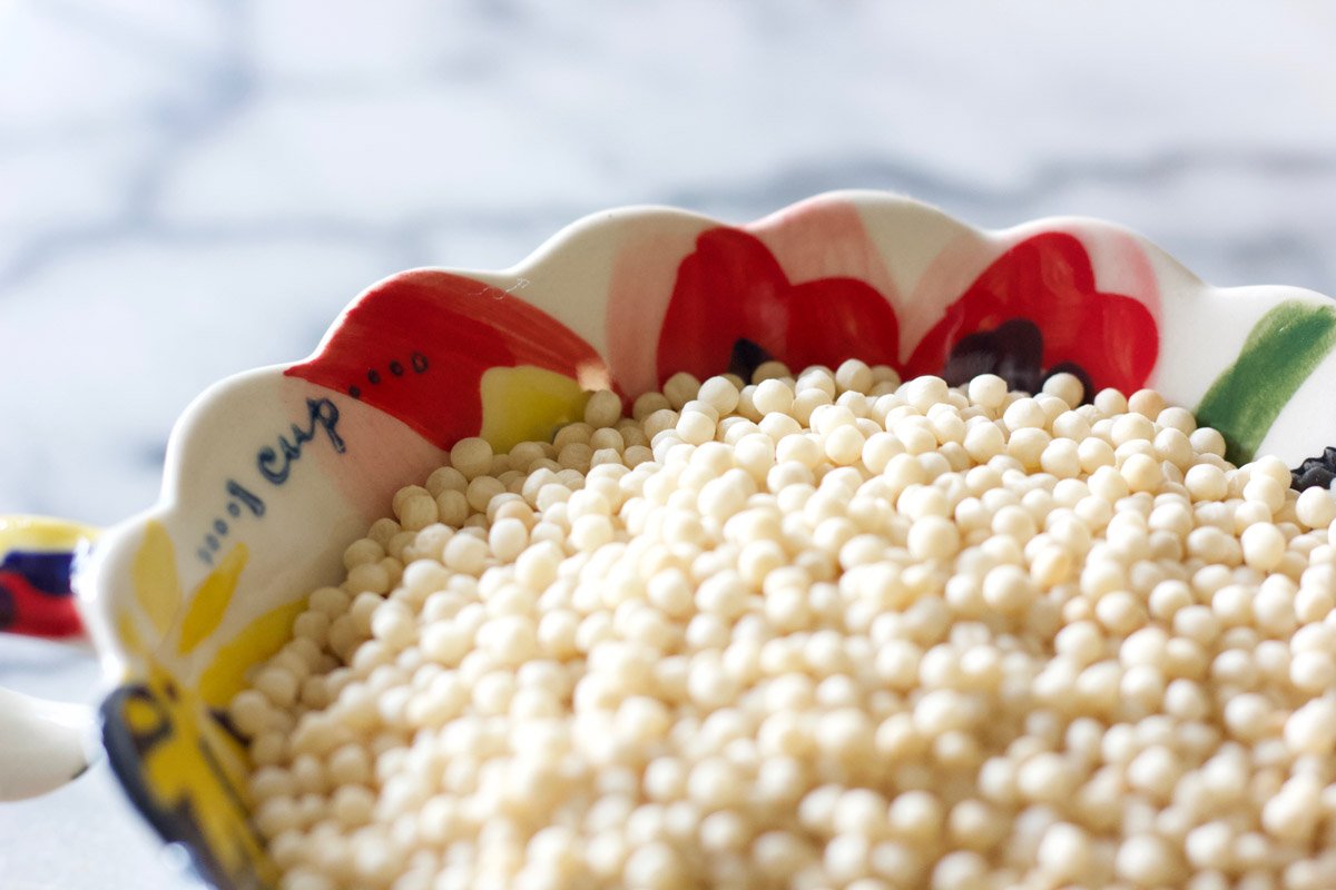 Israeli couscous in a measuring cup