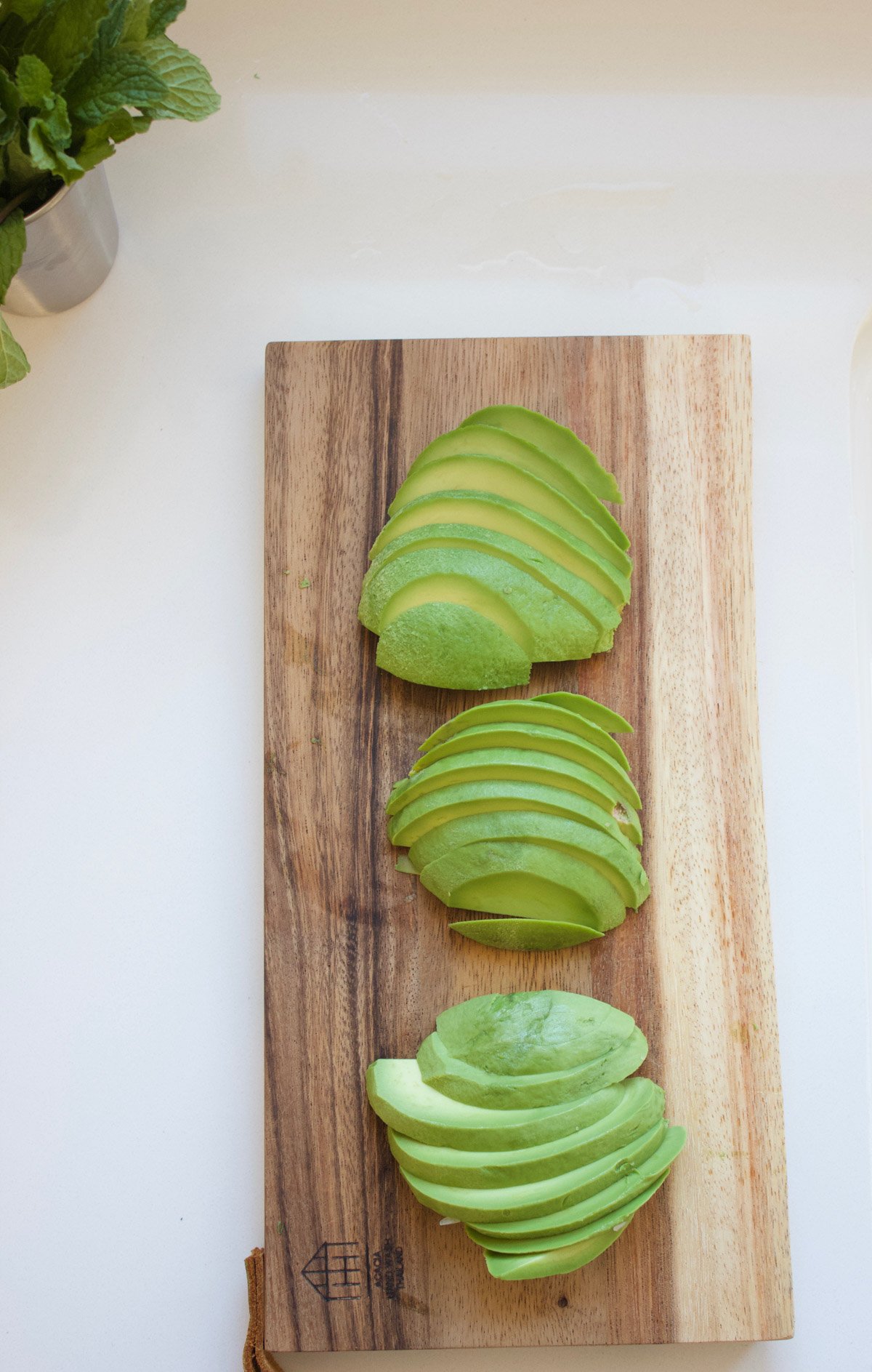 Sliced avocados on a cutting board 