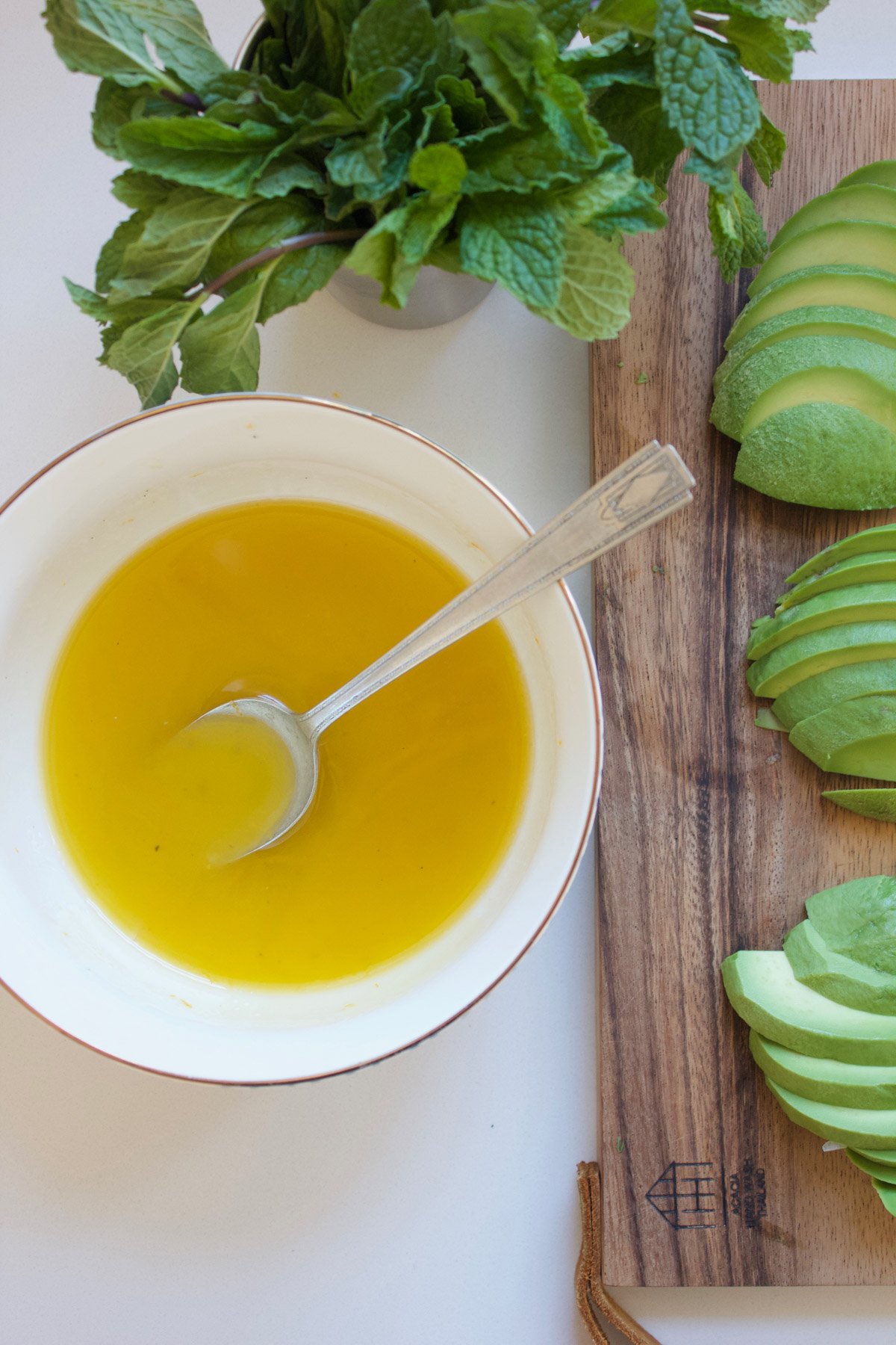 Citrus Vinaigrette in a bowl with a spoon.