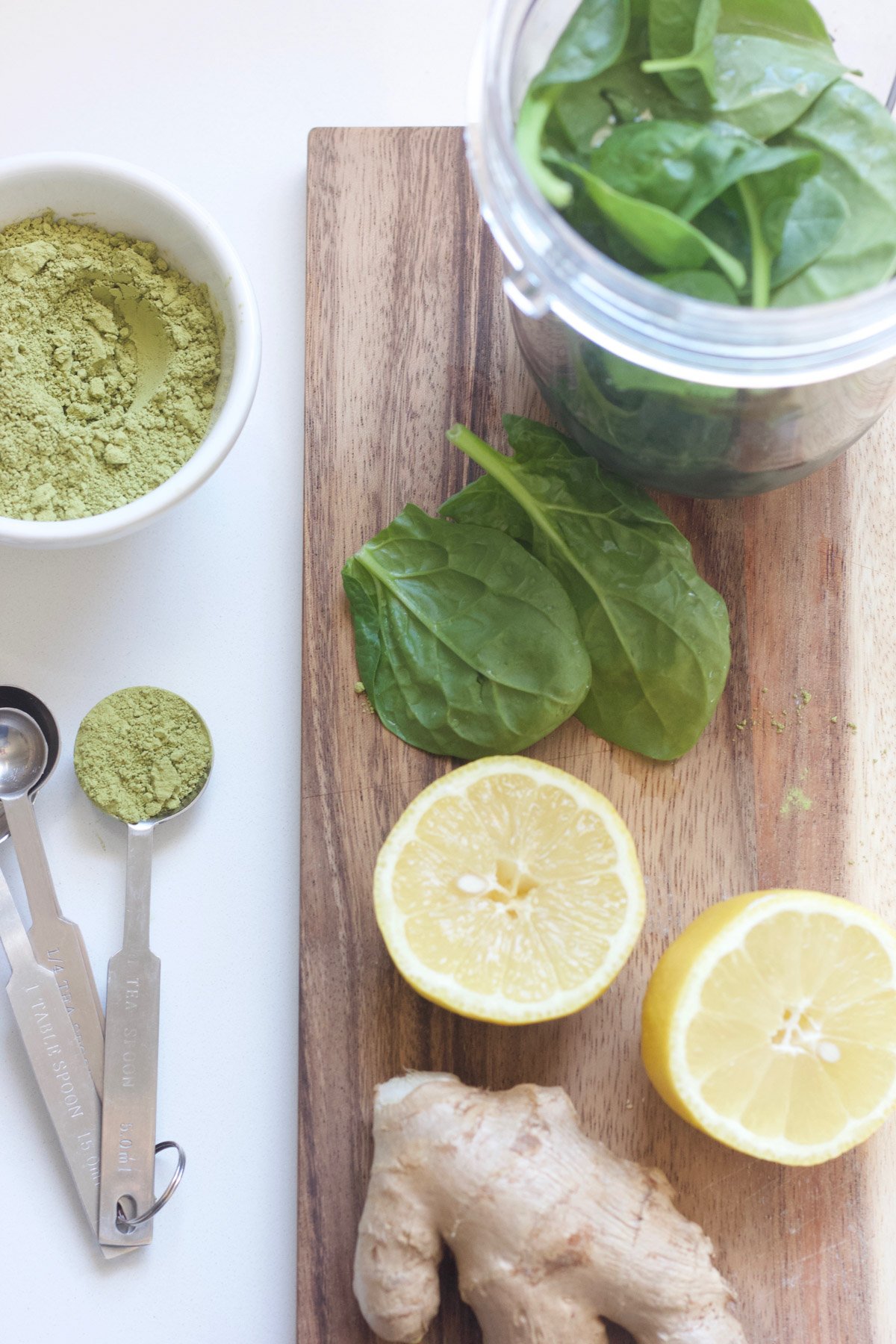 Green smoothie ingredients on a cutting board 
