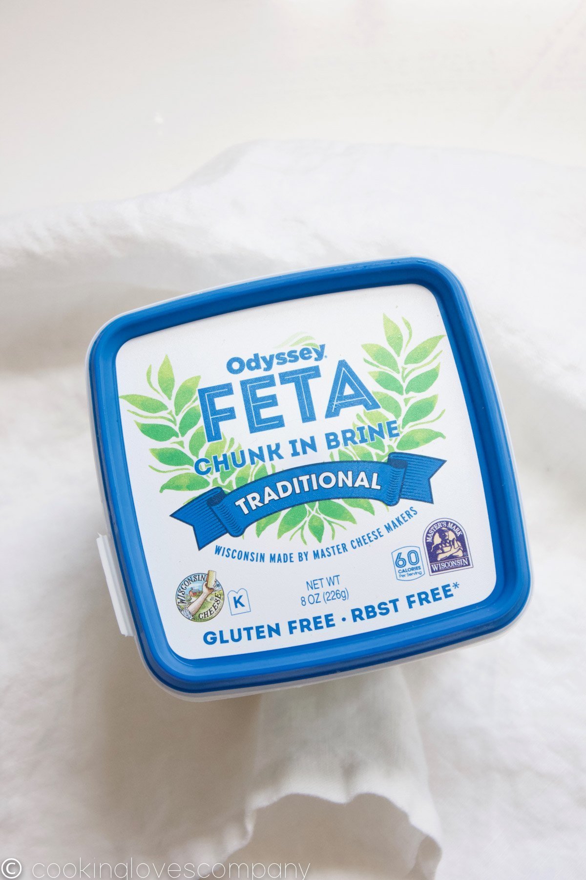 Overhead shot of Odessy Feta cheese package on a white napkin