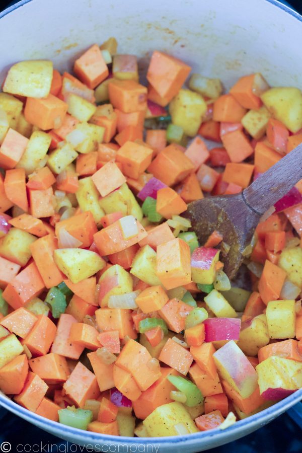 Close up of a dutch oven with diced vegetables