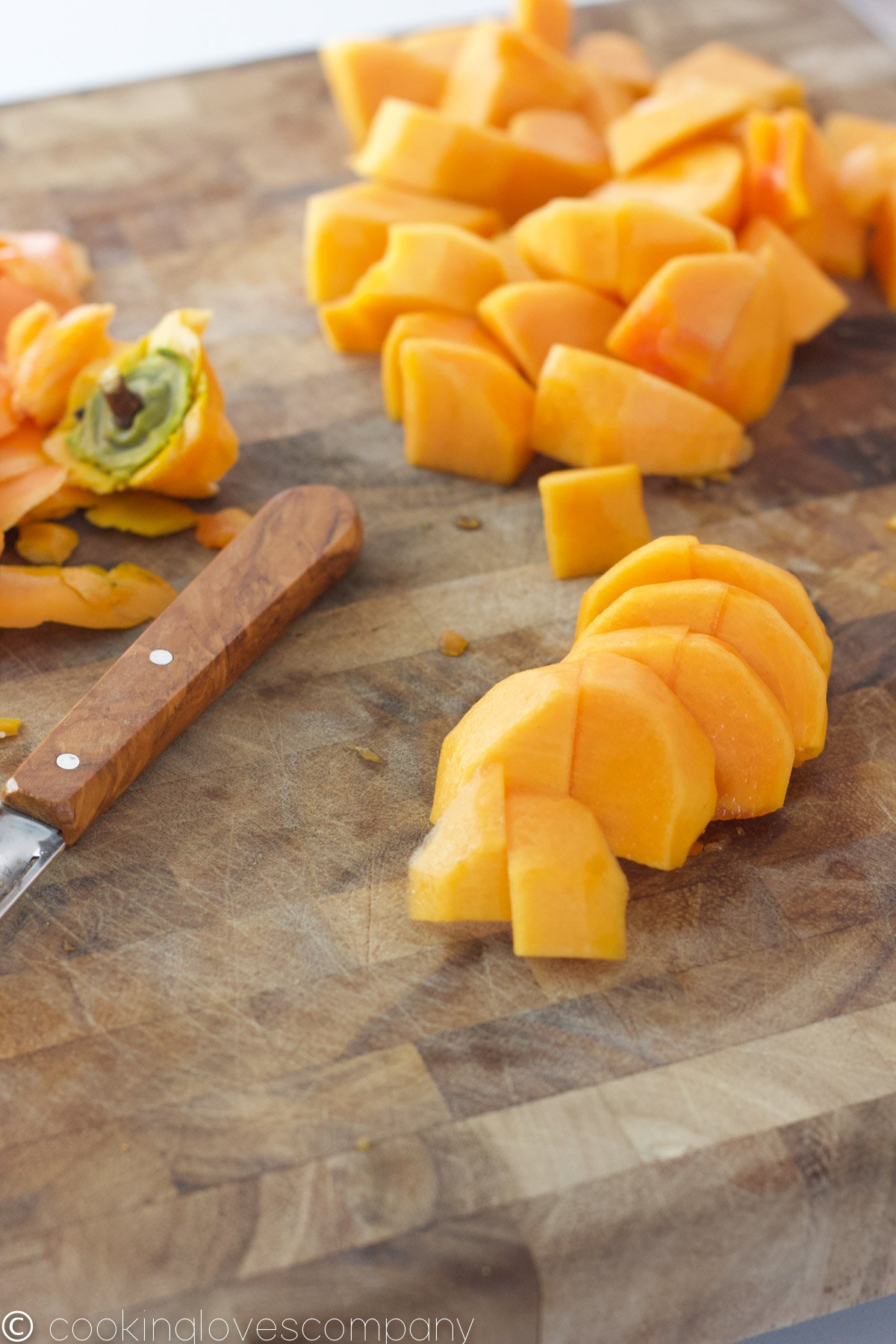 Chopped persimmon on a cutting board